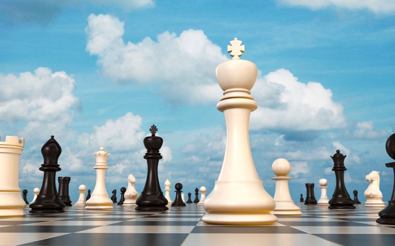Chess board, King in foreground, sky in background