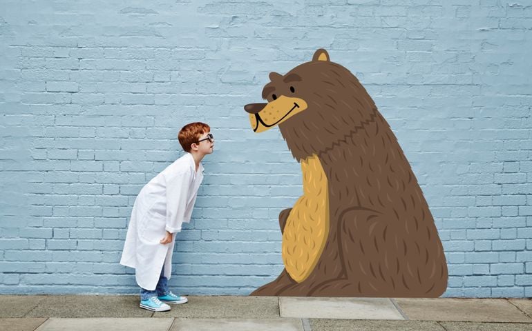 Boy dressed as a vet with cartoon bear