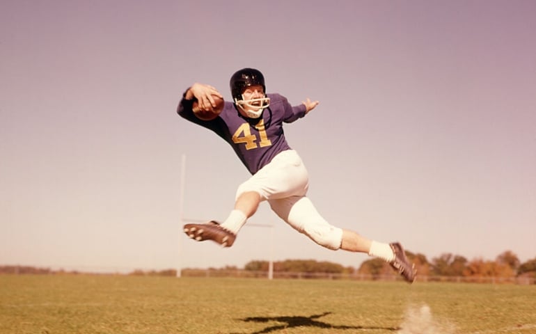 1960s JUMPING RUNNING FOOTBALL PLAYER QUARTERBACK UNIFORM HELMET JUMP RUN HIGHSCHOOL COLLEGE
