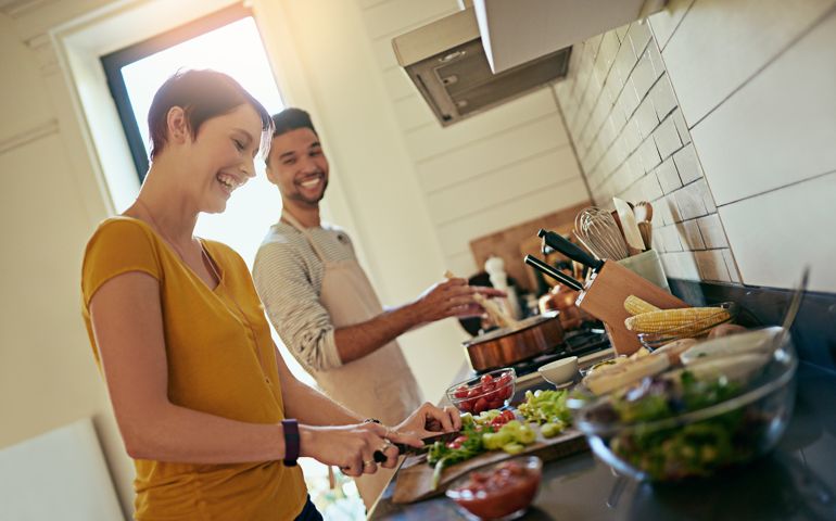 Cropped shot of a young couple cooking together in the kitchen