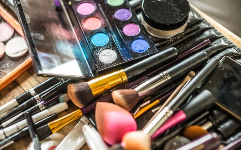detail of make up brushes and powder
