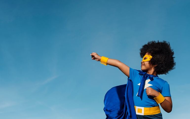 Girl with afro playing superhero