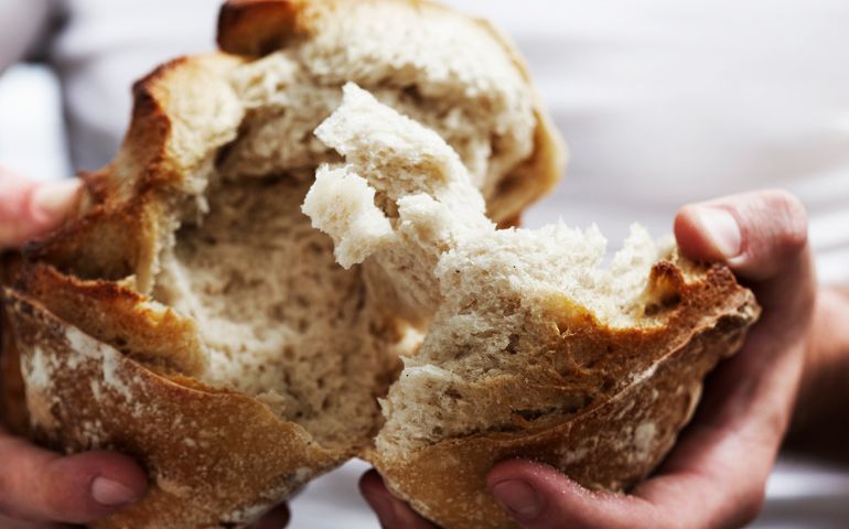 Man breaking bread
