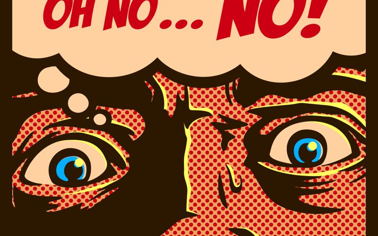 man in a panic with terrified eyes and face staring at something shocking or dreadful