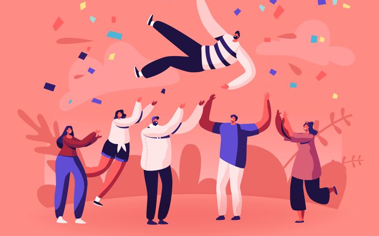 Team of Young People Tossing Up in Air Man with Confetti