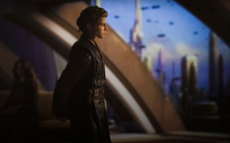 Jedi padawan Anakin Skywalker looking out of his apartment window on Coruscant