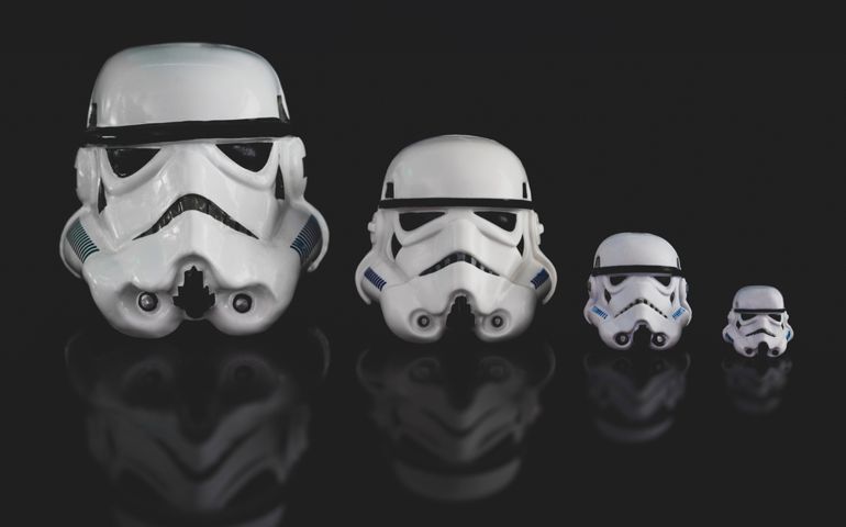 various sized Star Wars Imperial Stormtrooper helmets