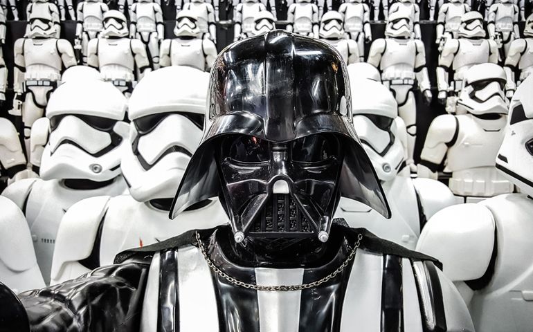 Darth Vader from Star wars with Stormtroopers army figures in background