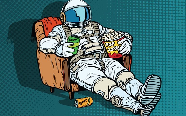 Astronaut the audience with beer and popcorn sitting in a chair. loneliness in space