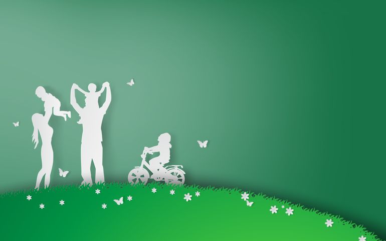 Green background happy family having fun playing in the field