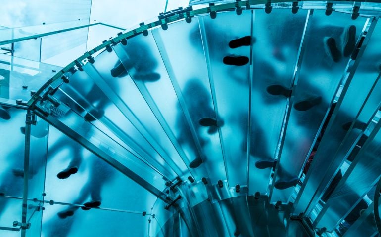 Feet On Glass Spiral Stairs