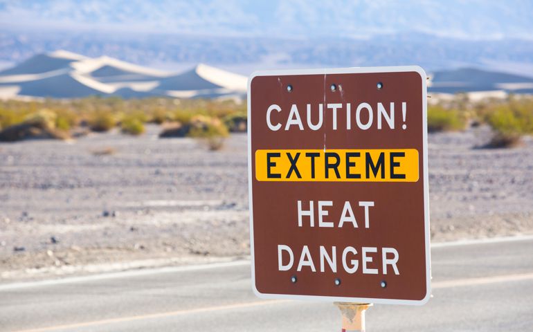 An extreme heat danger sign in Death Valley which is the lowest, hottest, driest place in the USA, with an average annual rainfall of around 2 inches, some years it does not receive any rain at all.