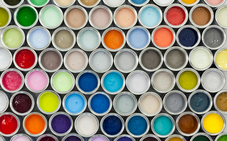 A variety of paint can samples arranged on a grid.