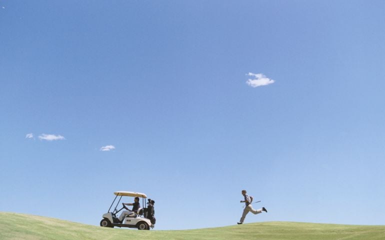 Golfer Chasing Golf Cart