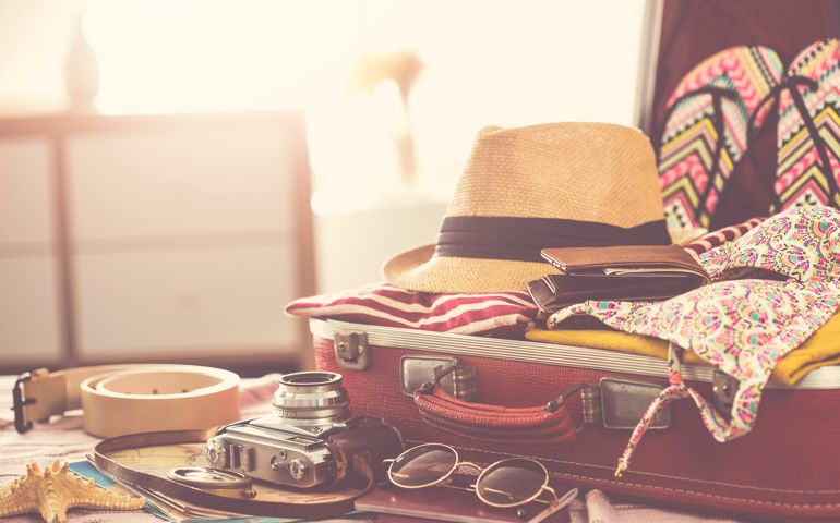 Travel suitcase preparing concept