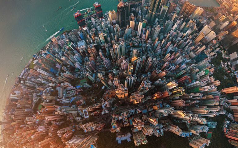 Little planet. Aerial view of Hong Kong Downtown. Financial district and business centers in smart city in Asia. Top view. Panorama of skyscraper and high-rise buildings.