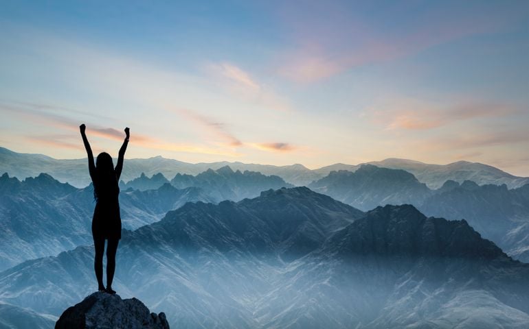 Woman Silhouette at sunset on hill