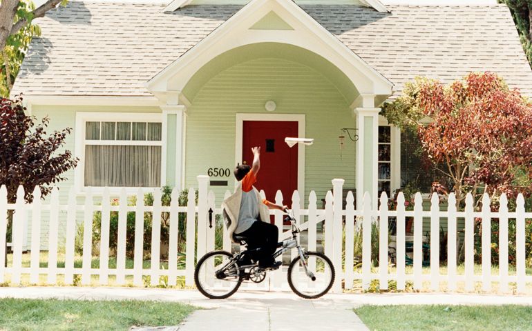 Paperboy Throwing Newspaper