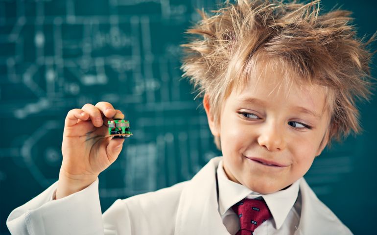 Cute little scientist with his new invention - miniature reactor that will solve humanity energy problems.