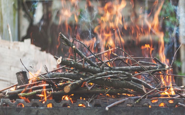 Firewood and branches for coals burn out in the brazier.