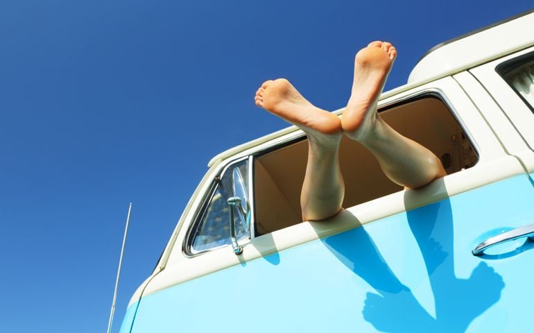 Woman's feet out of window of camper