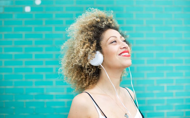 Joyful woman listening to music