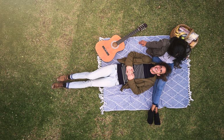 High angle shot of a young couple having a romantic date in the park