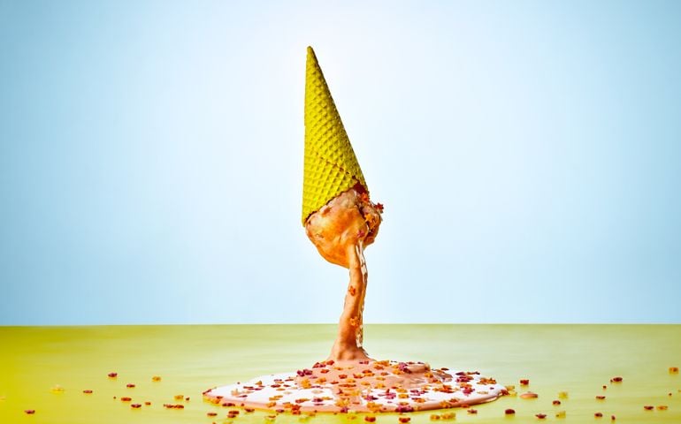 Upside down melting ice cream cone on the floor