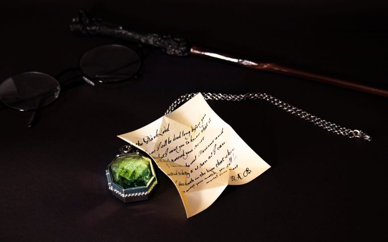 wand and glasses of Harry Potter, Slytherin's Locket, letter of Regulus Arcturus Black on the black background