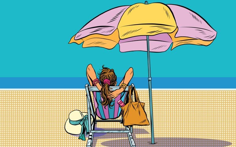 Girl in a deckchair on the beach