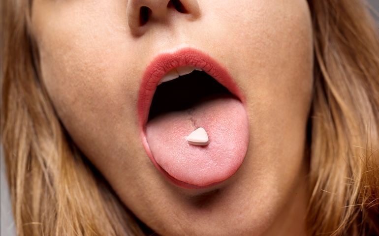 Young girl clubber partying with the use of recreational drugs