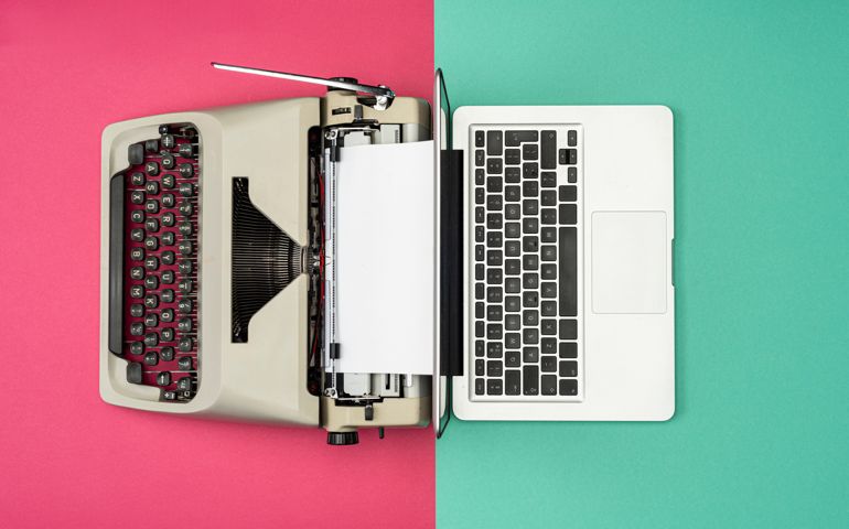 Modern Laptop Computer with Antique Typewriter