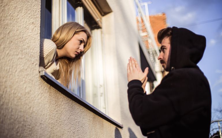 Man begging his girlfriend to forgive him