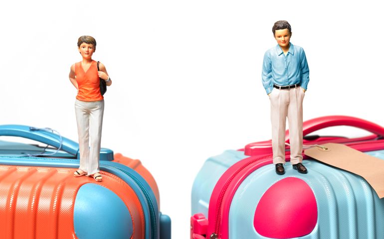 Divorce holiday couple on suitcase