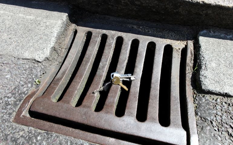 Keys tumbling into drain