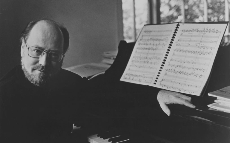 John Williams, US composer, conductor and pianist, poses beside a grand piano at this home in Los Angeles, California, USA, 31 January 1980. Williams is the conductor with the 'Boston Pops' orchestra.