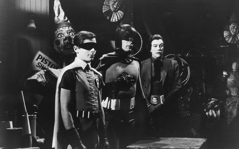 L-R: American actors Burt Ward, as Robin, Adam West, as Batman, and Cesar Romero (1907 - 1994), as The Joker, stand in a room with circus props in a still from the television series, 'Batman,' c. 1967.