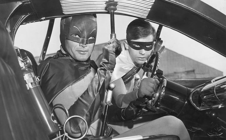 1966: Actors Adam West (left) and Burt Ward as Batman and Robin in the Batmobile in a still from the television series, 'Batman'.