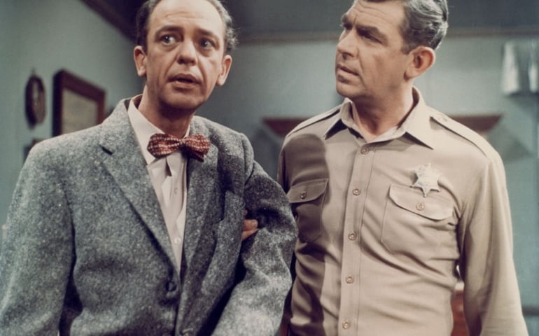 Don Knotts (1924 - 2006) as Deputy Barney Fife and Andy Griffith (right) as Sheriff Andy Taylor in a scene from the television series 'The Andy Griffith Show', circa 1965.