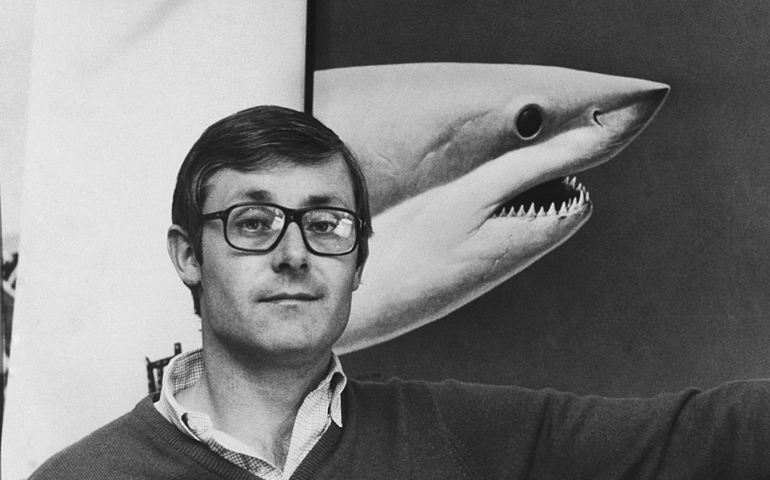 American author Peter Benchley (1940 - 2006), with a picture of a shark, at his home in Princeton, New Jersey, 2nd February 1976. Benchley is best known for his novel 'Jaws' and for co-writing the screenplay for the film adaptation.