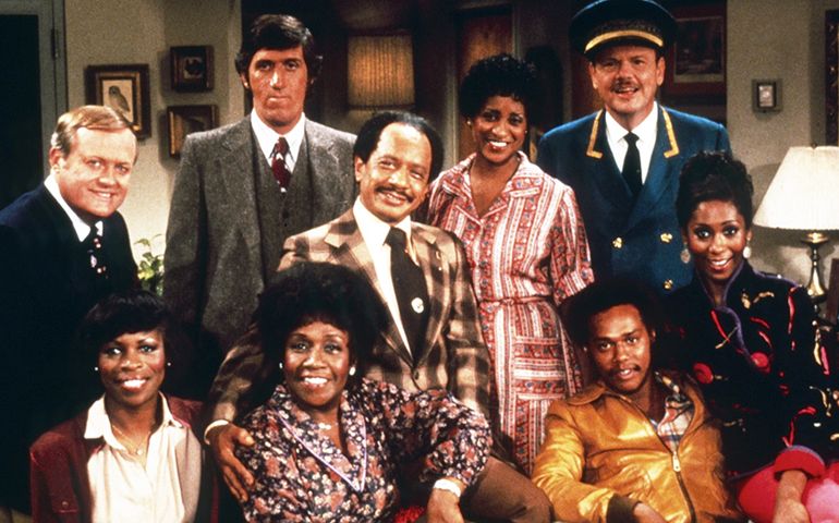 THE JEFFERSONS, from left: Franklin Cover, Roxie Roker, Paul Benedict, Isabel Sanford (front), Sherman Hemsley, Marla Gibbs, Mike Evans (front), Ned Wertimer, Berlinda Tolbert, 1975-85