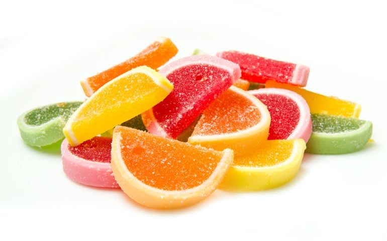 Color fruit jelly candies isolated on white background
