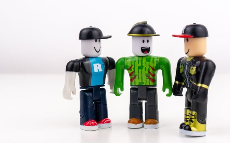 Roblox Toy characters/figures positioned so they look like they are talking to each other, isolated on a white background A