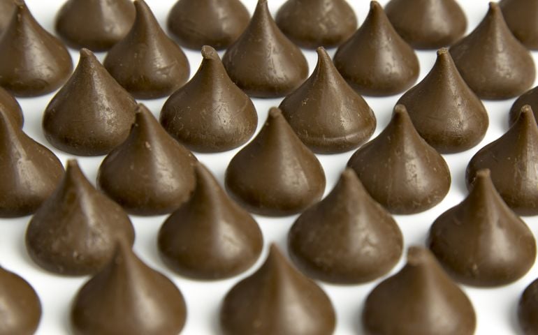 Chocolate drops in rows with only a few rows in focus.