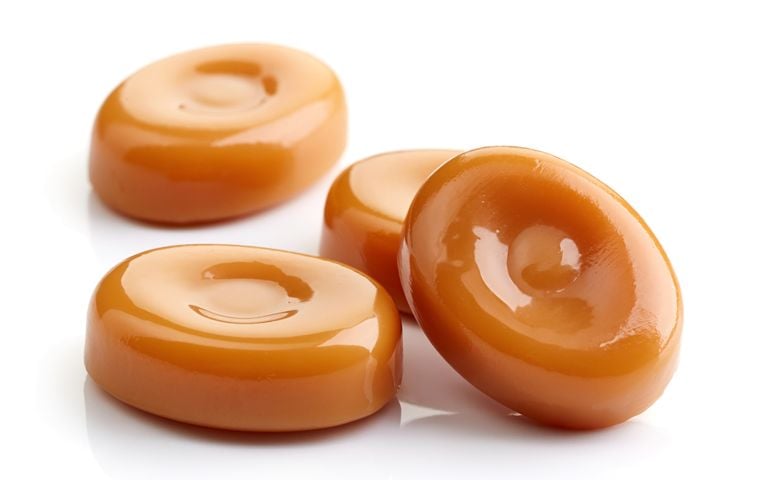 caramel candies isolated on white background