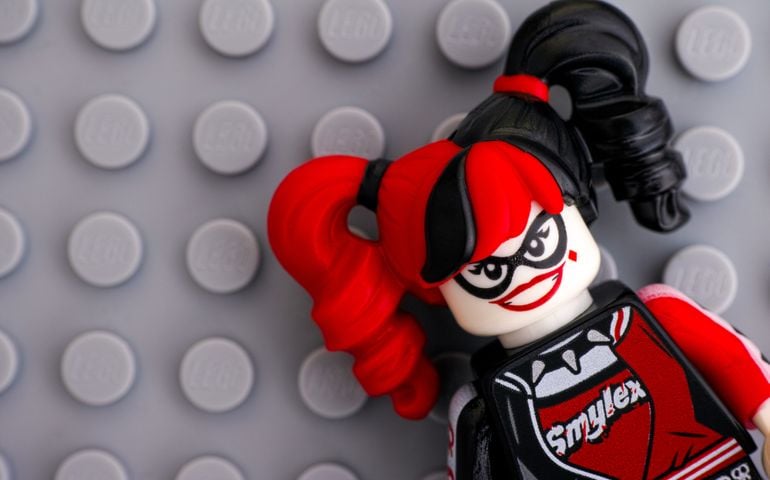 Lego Batman Movie minifigure - Harley Quinn on Lego gray baseplate background