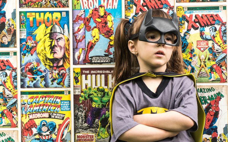 A girl in Batman costume
