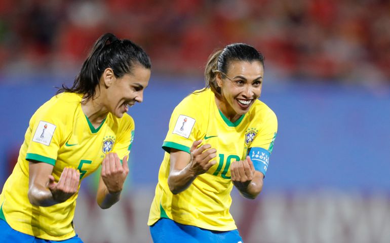 Brazil's Marta, right, celebrates with Brazil's Thaisa after scoring her side's first goal during the Women's World Cup Group C soccer match between Italy and Brazil at the Stade du Hainaut in Valenciennes, France, Tuesday, June 18, 2019