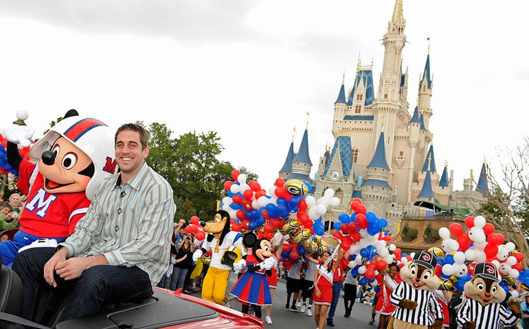LAKE BUENA VISTA, FL - FEBRUARY 07: In this handout photo provided by Disney, Super Bowl XLV Most Valuable Player Aaron Rodgers takes a celebratory ride with Mickey Mouse, following the Green Bay Packers' 31-25 victory over the Pittsburgh Steelers February 6, 2011, at Walt Disney World Resort February 7, 2011 in Lake Buena Vista, Florida. Rodgers was 24 for 39 for 304 yards and threw three touchdowns in the Packers' Super Bowl win. Immediately after Super Bowl XLV was over, Rodgers shouted "I'm Going to Disney World!" and "I'm Going to Disneyland!" for TV cameras as the star of the latest Disney Parks advertisement