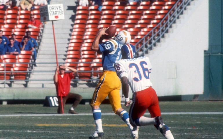 SAN DIEGO, CA - NOVEMBER 23: Lance Alworth #19 of the San Diego Chargers makes the catch as Bill Thompson #36 of the Denver Broncos defends during an NFL game on November 23, 1969 at San Diego Stadium in San Diego, California.